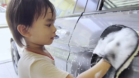 Boy washing car 스톡 동영상 193790788
