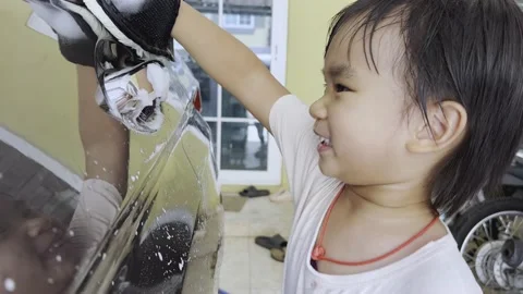 Boy washing car 스톡 동영상 193790818
