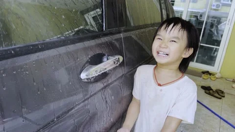 Boy washing car 스톡 동영상 193790839