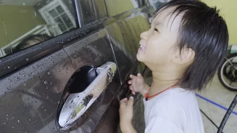 Boy washing car 스톡 동영상 193790861