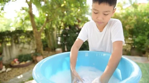 Boy washing cloth 스톡 동영상 71394245