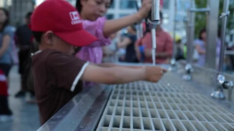 Boy washing hands outdoor Stock Footage 51891314