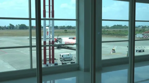 Boy watch airplane preparation from inside Stock Footage 144166416