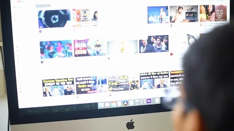 Boy Watches Video On Mac PC, Close-Up Stock Footage 129952793