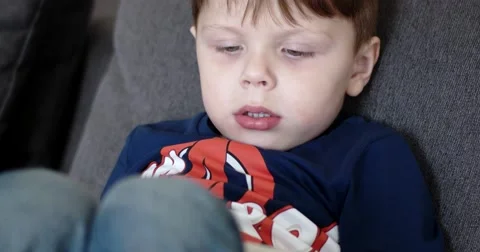 Boy Watching Cartoons on a Tablet Computer, Side View Stock Footage 62521593