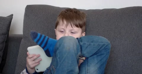 Boy Watching Cartoons on a Tablet Computer, Side View 動画素材 62521618