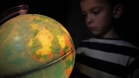 Boy is watching at globe Stock Footage 41607552
