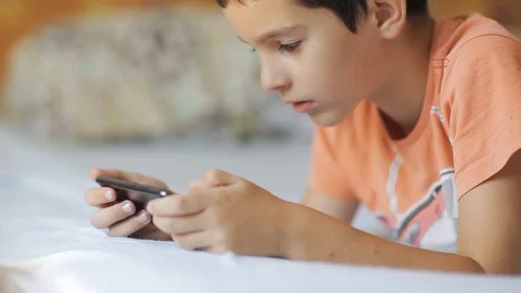 Boy watching media content on smartphone. Stock Footage 112187614