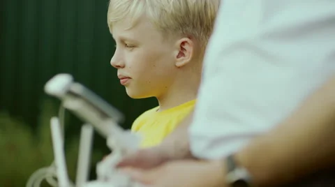 Boy watching quadcopter drone Stock Footage 68082413