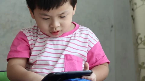 Boy watching smart phone. 스톡 동영상 63500305