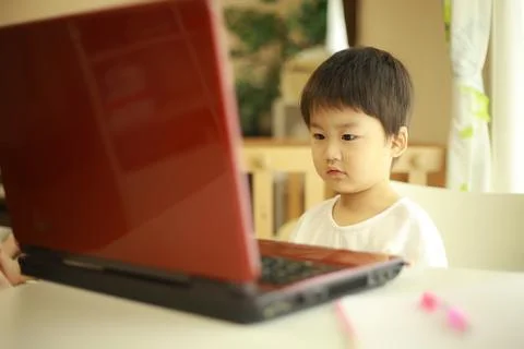Boy watching video on computer Stock Photos