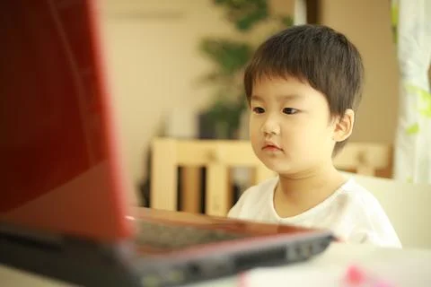 Boy watching video on computer Stock Photos