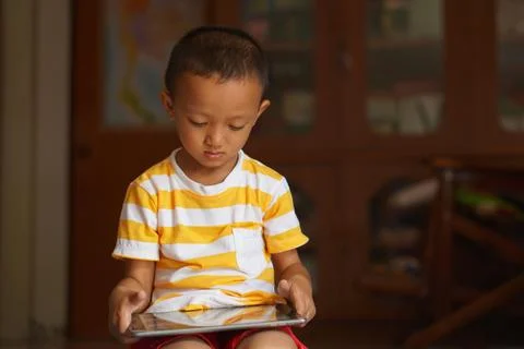 Boy watching video on computer 스톡 사진