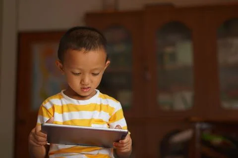Boy watching video on computer 스톡 사진