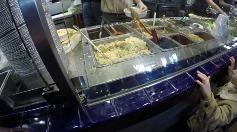 Boy watching workers prepare his food Stock Footage 47798292