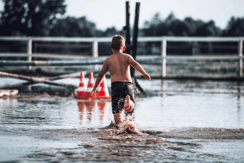 Boy in water Stock Photos