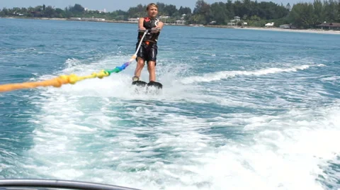 Boy Water skiing on The Ocean Video stock 63992680