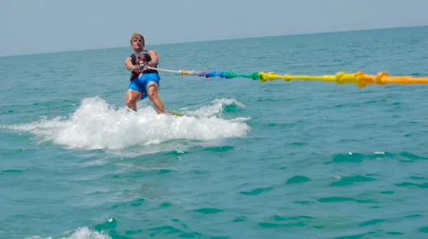 Boy Water skiing on The Ocean Video stock 63992704