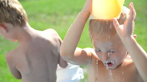 Boy water splash Stock Footage