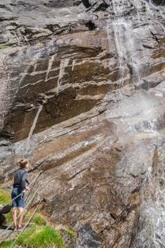 Boy at the waterfall Stock Photos