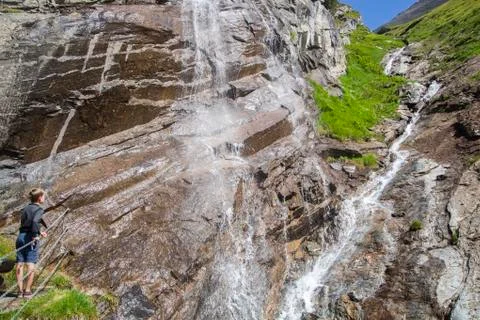 Boy at the waterfall Stock Photos