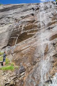 Boy at the waterfall Stock Photos