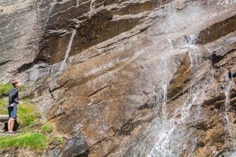 Boy at the waterfall Stock Photos