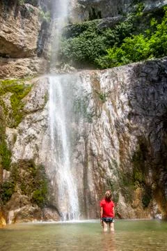 Boy at the waterfall Stock Photos