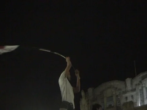 Boy waves Egyptian Flag during Pro Morsi Political Demonstration. 動画素材 92842321