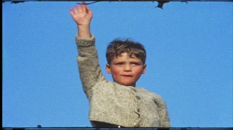 Boy waves goodbye from summit of mountain (vintage 8 mm amateur film) Stock Footage 828865