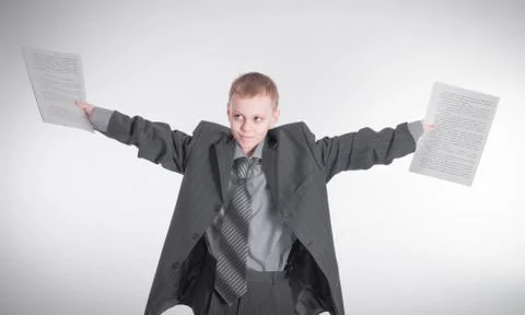 Boy waving papers Stock Photos