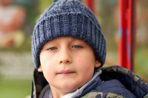 Boy weared in JAcket and hat Stock Photos