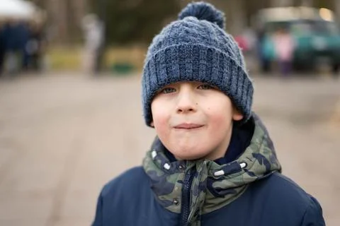 Boy weared in JAcket and hat Stock Photos