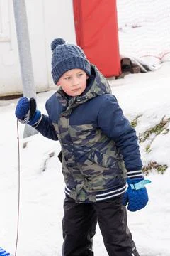 Boy weared in JAcket and hat Stock Photos