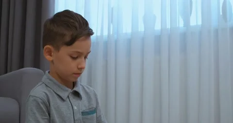 Boy wearing grey tee in the room. Mid-shot Stock Footage 212346427