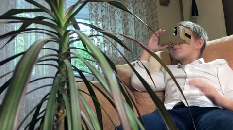 Boy wearing virtual reality goggles 4K. Stock Footage 67533205