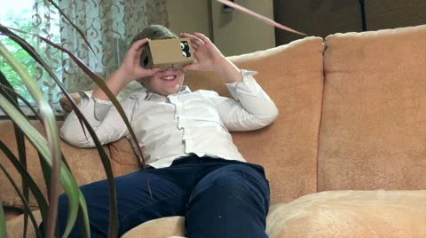 Boy wearing virtual reality goggles 4K. Stock Footage 67563602