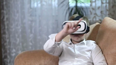 Boy wearing virtual reality goggles HD. Stock Footage 67580926