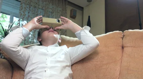 Boy wearing virtual reality goggles 4K. Video stock 67581241