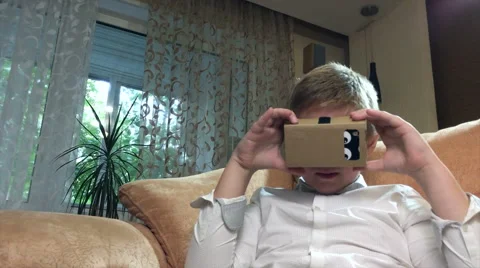 Boy wearing virtual reality goggles 4K. Stock Footage 67581265