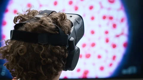 Boy Wearing Virtual Reality Headset Exploring Science Exhibition in Gallery Stock Footage 343611744