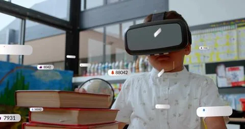 Boy wearing VR headset exploring augmented lesson in classroom, with books globe Stock Photos