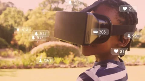 Boy wearing VR headset scanning park in tech demo, headset activating floating Stock Footage 333632076