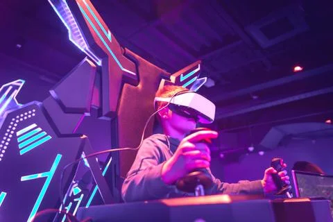 Boy wearing vr headset at virtual reality center Stock Photos