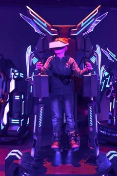 Boy wearing vr headset at virtual reality center Stock Photos