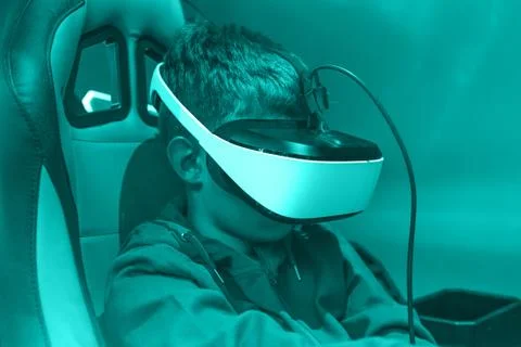 Boy wearing vr headset at virtual reality center Stock Photos