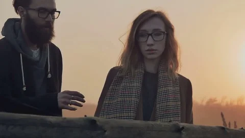 The boy whispered something in the ear of his girlfriend Stock Footage 72921461