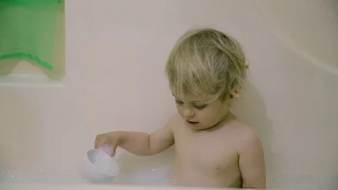 Boy in white bath with foam Stock-Footage 74712971
