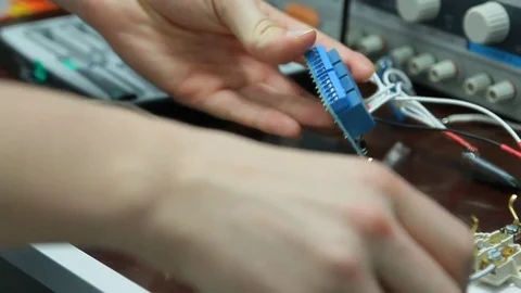 A boy with a white coat is working in the scientific laboratory. Close-up of a h Stock Footage 84785274