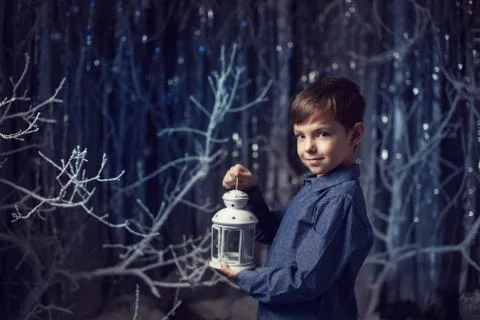 Boy with a white lantern Stock Photos